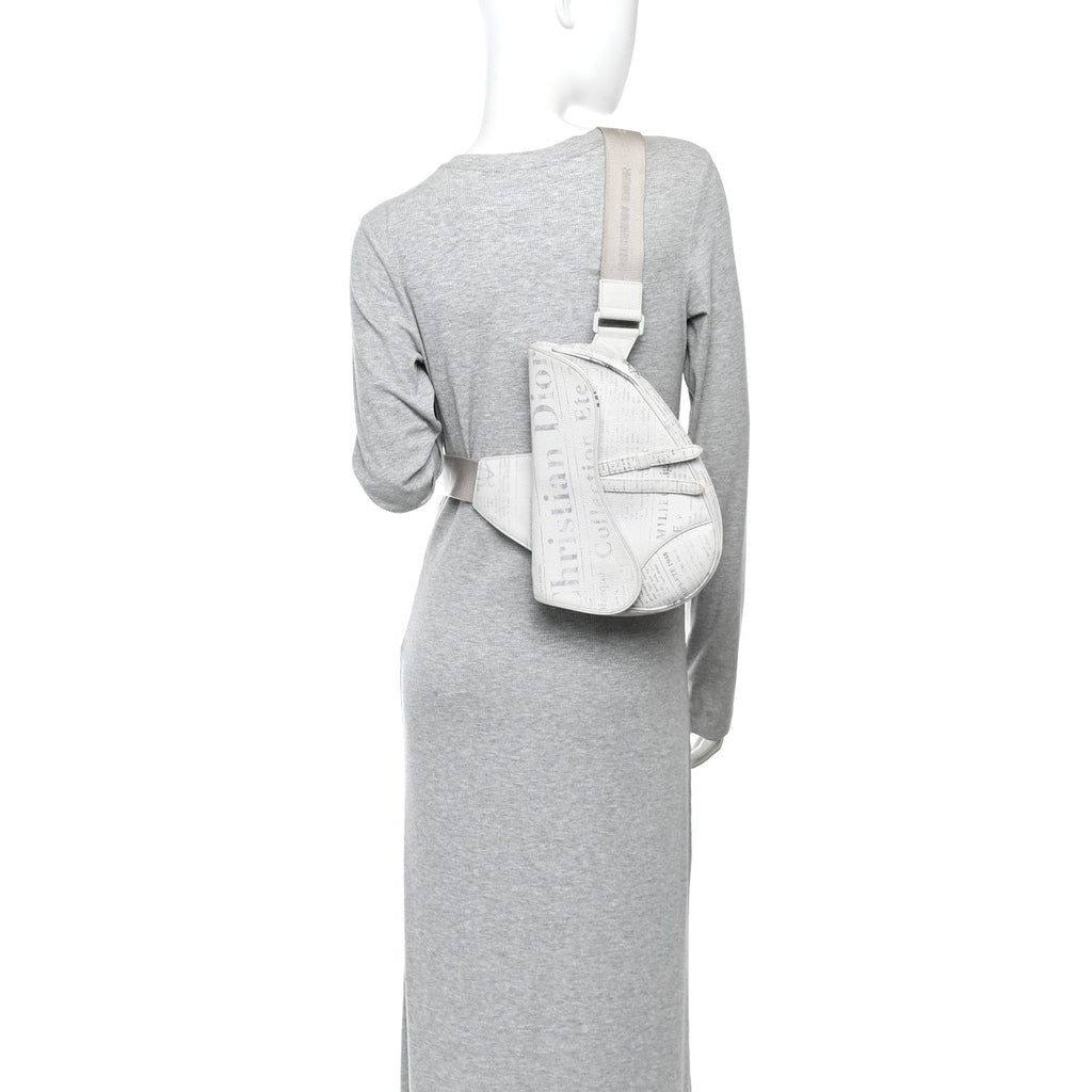 X Daniel Arsham Grained Calfskin Newspaper Print Saddle Bag White AT My store