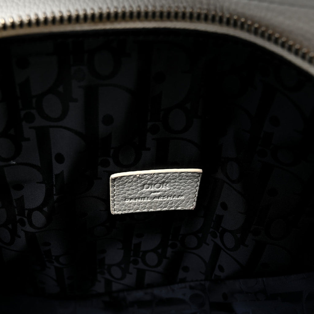 X Daniel Arsham Grained Calfskin Newspaper Print Saddle Bag White AT My store