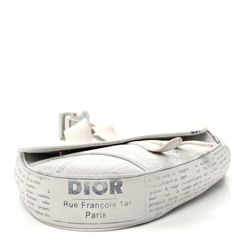 X Daniel Arsham Grained Calfskin Newspaper Print Saddle Bag White AT My store
